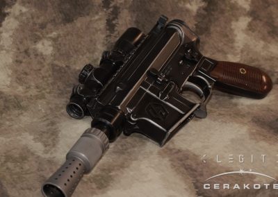 Canto Arms DL-15 Heavy Blaster with scope in custom "Used Universe" finish by LEGIT Cerakote. This AR-15 pistol looks similar to worn bluing on Han Solo's DL-44 from Star Wars.