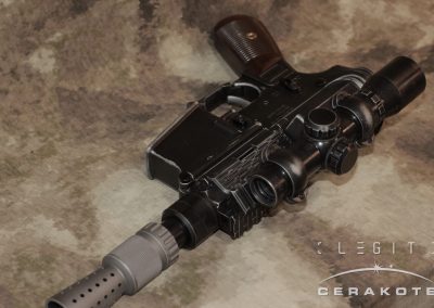 Canto Arms DL-15 Heavy Blaster with scope in custom "Used Universe" finish by LEGIT Cerakote. This AR-15 pistol looks similar to worn bluing on Han Solo's DL-44 from Star Wars.